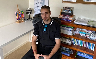 Linkoln sitting in the office chair