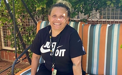 Charlie sitting in a swing outdoors and smiling