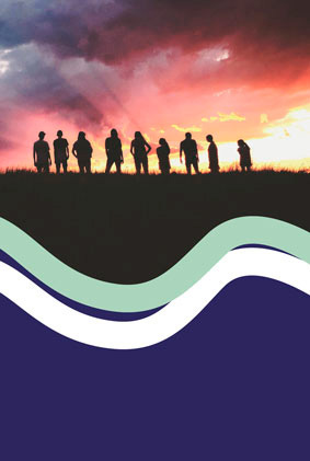 A group of people taken from far on the sunset